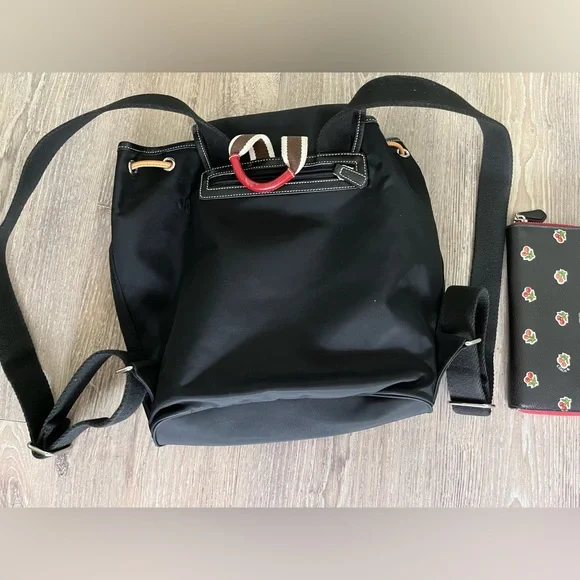 COACH canvas backpack and COACH leather wallet.